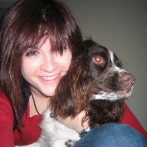 My wonderful Springer Spaniel, Zoe. Trying to escape from her overly affectionate human.