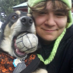 I more or less stuffed the ball in her mouth and made her take the picture with me :P
