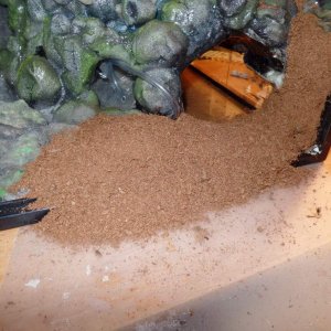 24 hours after I put the GS down, I coated it heavily with black silicone and then smooshed Coco coir all over the silicone.  I repeated this step unt