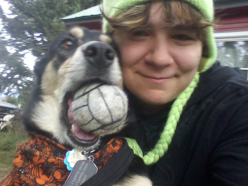 I more or less stuffed the ball in her mouth and made her take the picture with me :P